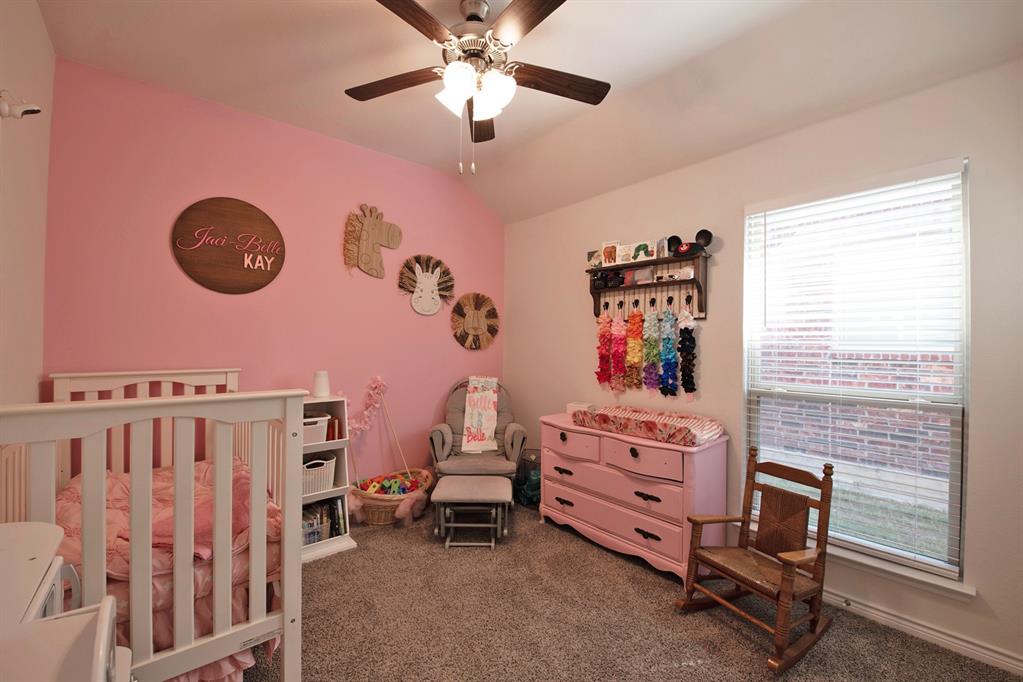 3970 Sidney Lane Forney, TX 75126 - Photo 17 of 25 a view of a livingroom with furniture and a fan