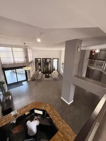 a kitchen with stainless steel appliances granite countertop a refrigerator a stove and a sink