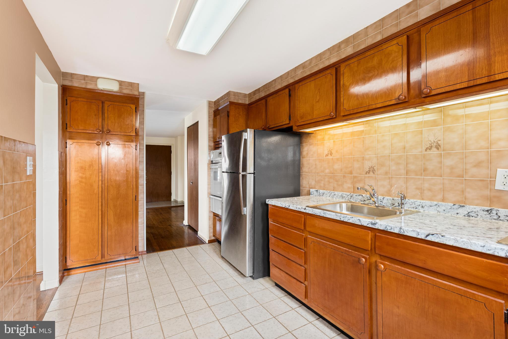 1041 Foxwood Lane Baltimore, MD 21221 - Photo 11 of 45 a kitchen with stainless steel appliances granite countertop a refrigerator and a sink