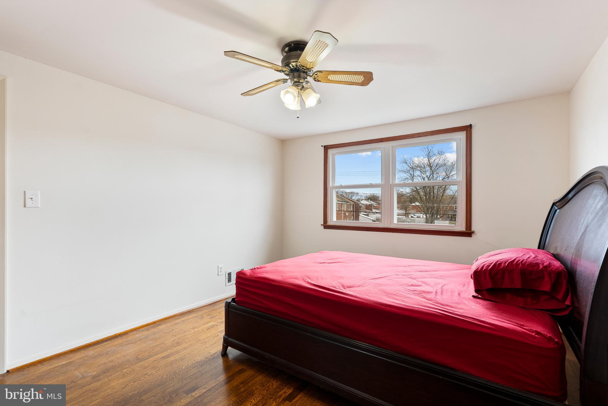 1041 Foxwood Lane Baltimore, MD 21221 - Photo 22 of 45 a bedroom with a bed and a window