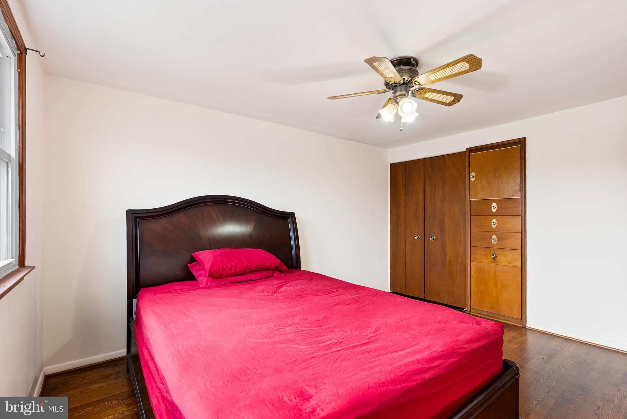 1041 Foxwood Lane Baltimore, MD 21221 - Photo 24 of 45 a bedroom with a bed and a chandelier