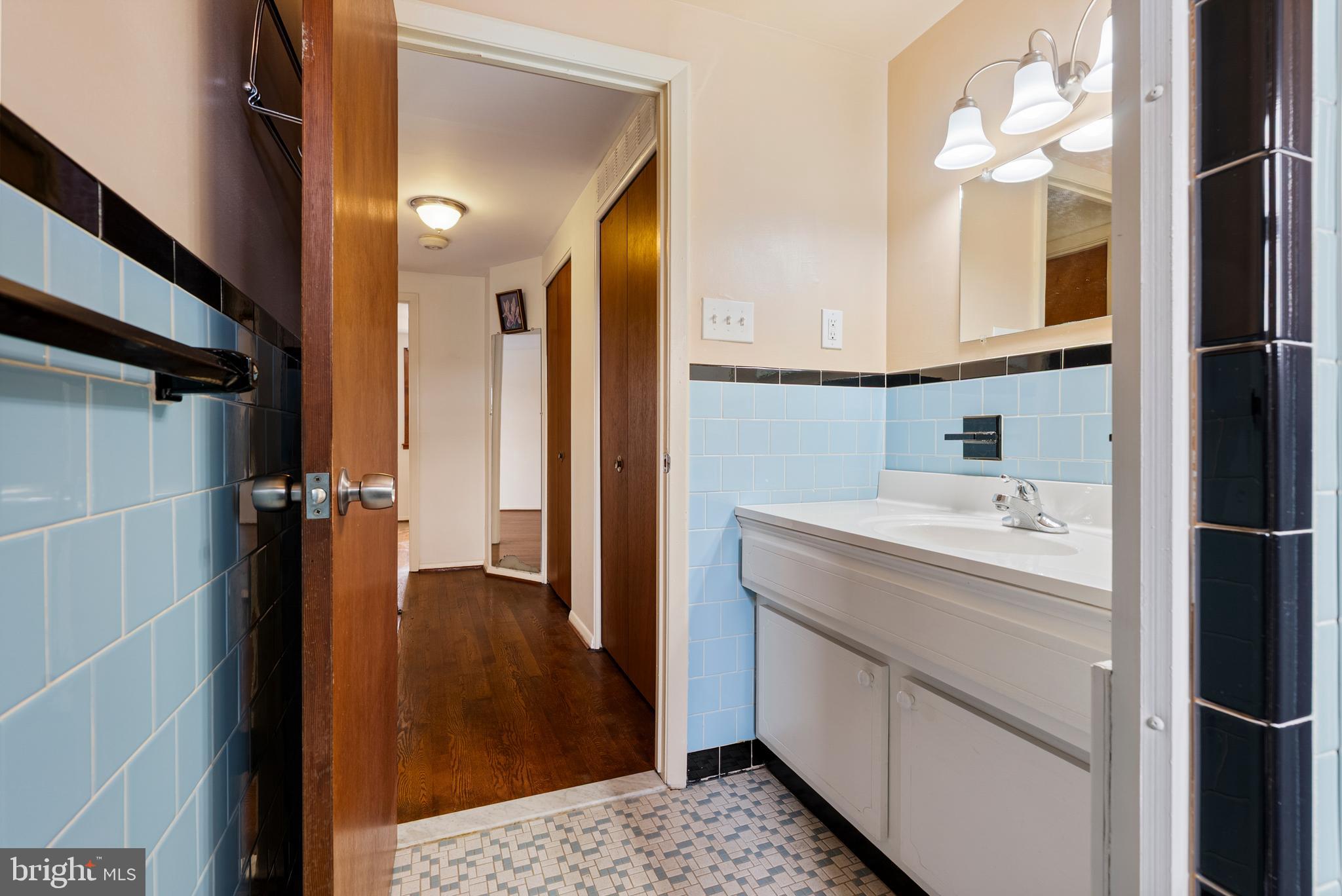 1041 Foxwood Lane Baltimore, MD 21221 - Photo 28 of 45 a bathroom with a sink and a mirror