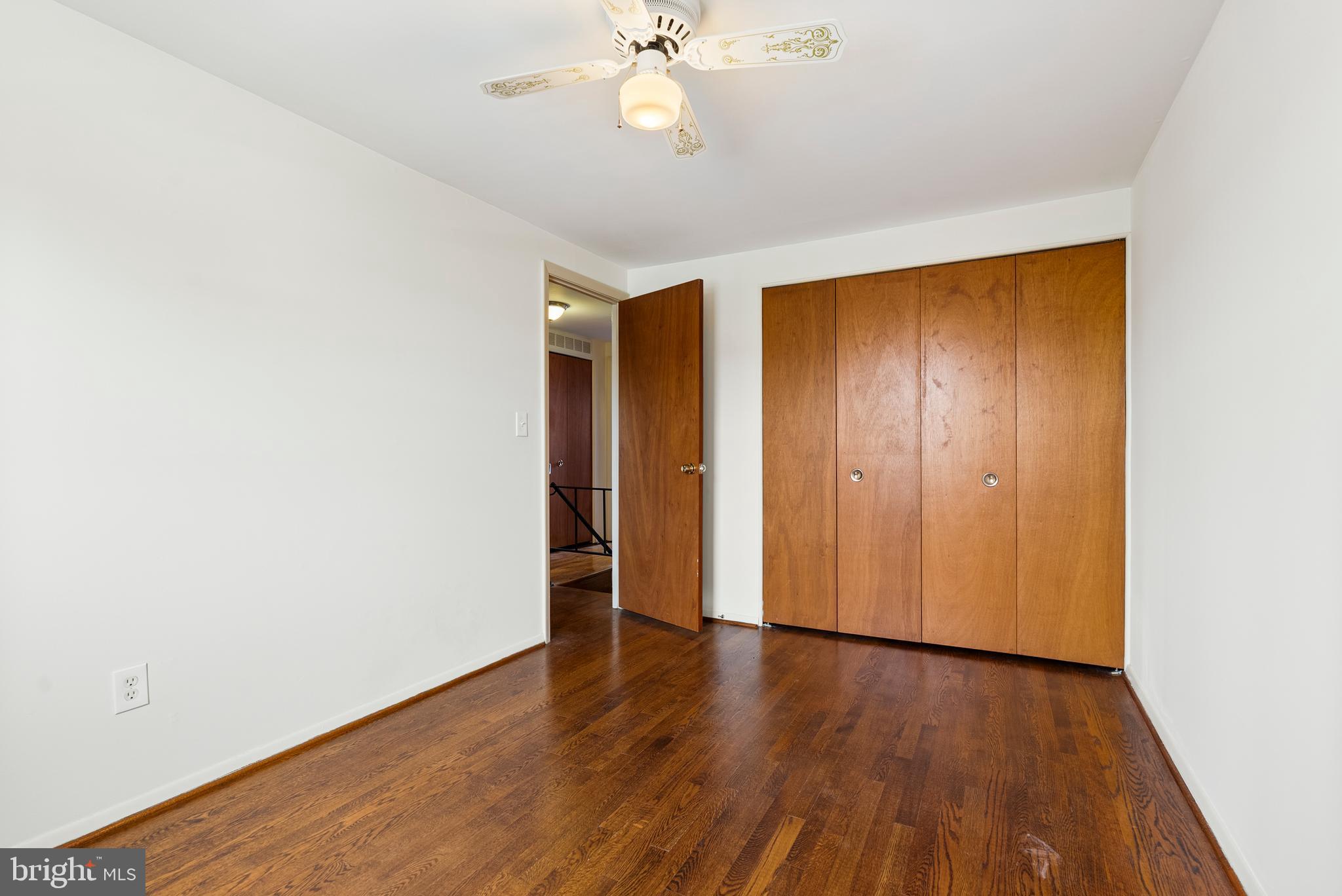 1041 Foxwood Lane Baltimore, MD 21221 - Photo 30 of 45 an empty room with wooden floor and fan