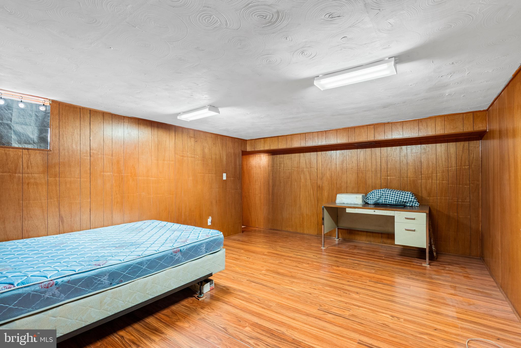 1041 Foxwood Lane Baltimore, MD 21221 - Photo 35 of 45 a bedroom with a bed and a table