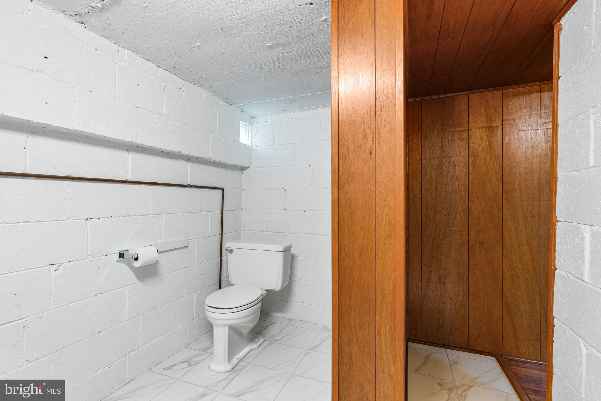 1041 Foxwood Lane Baltimore, MD 21221 - Photo 36 of 45 a bathroom with a toilet and a shower