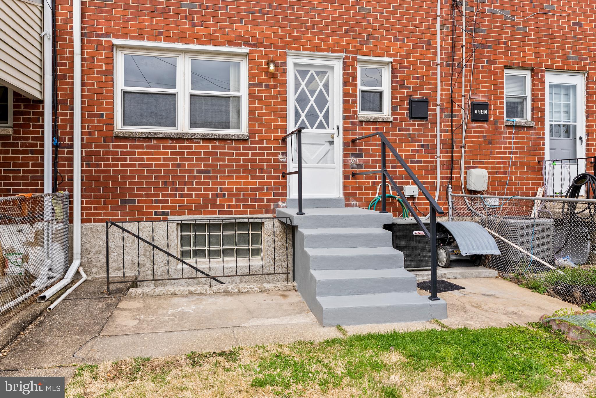 1041 Foxwood Lane Baltimore, MD 21221 - Photo 42 of 45 a view of a house with a wooden bench