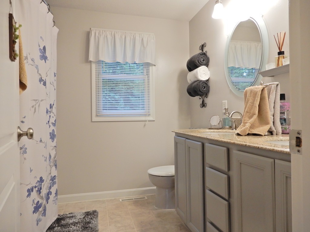 100 Crestwood Road Brimfield, MA 01010 - Photo 20 of 28 a bathroom with a sink a toilet and a mirror