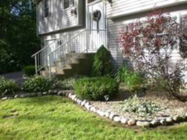 100 Crestwood Road Brimfield, MA 01010 - Photo 4 of 28 a view of a yard with plants and large trees