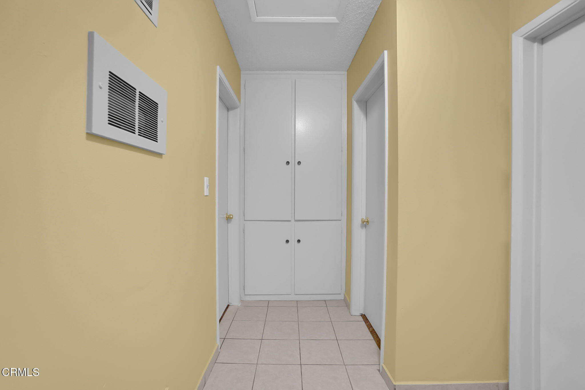 9501 Steele Street, Unit D Rosemead, CA 91770 - Photo 7 of 20 a view of a hallway with wooden floor and a bathroom