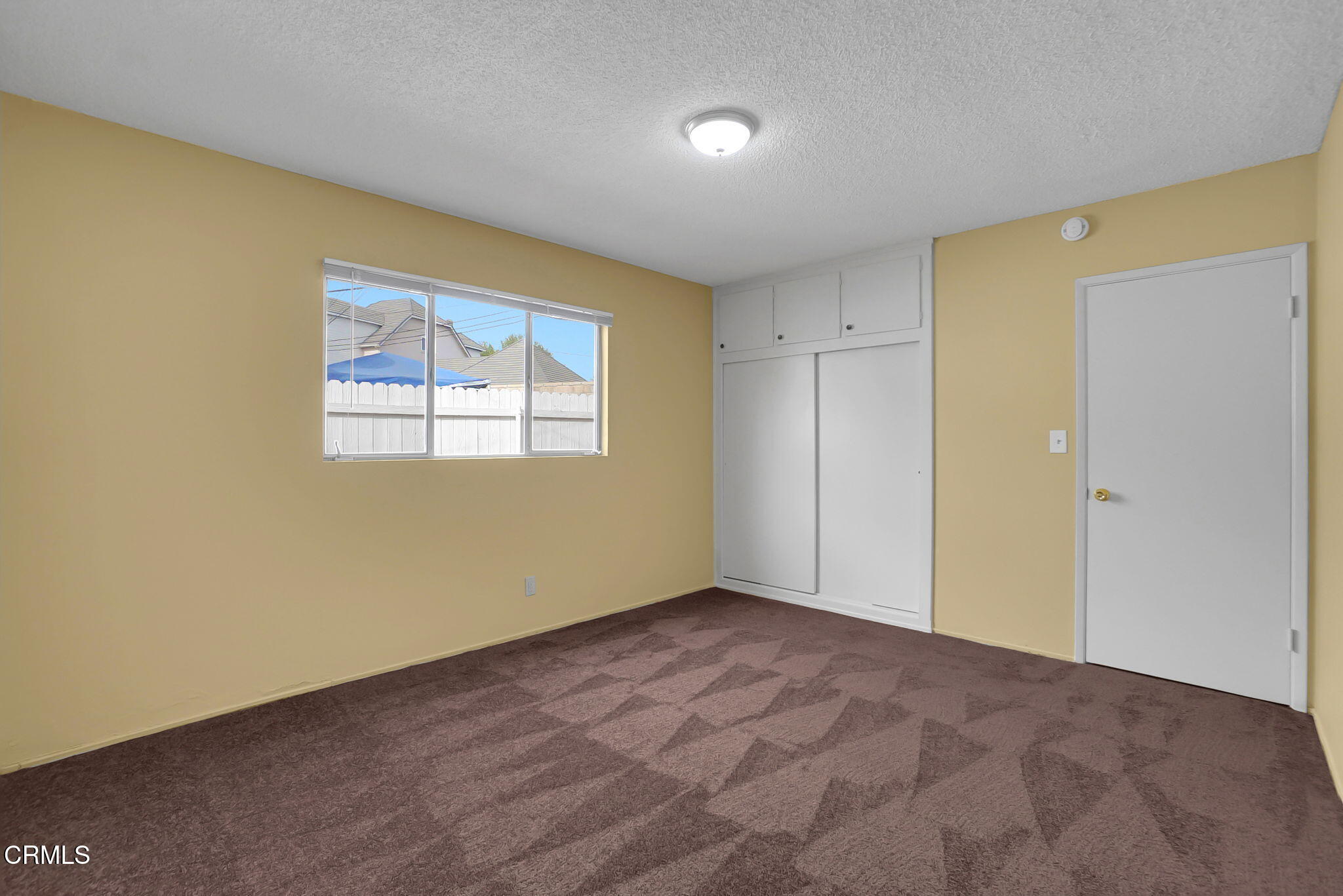 9501 Steele Street, Unit D Rosemead, CA 91770 - Photo 9 of 20 a view of an empty room with a window