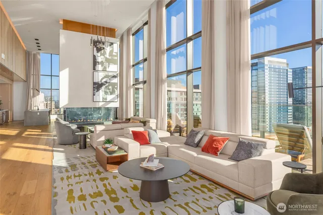 a living room with furniture and a large window