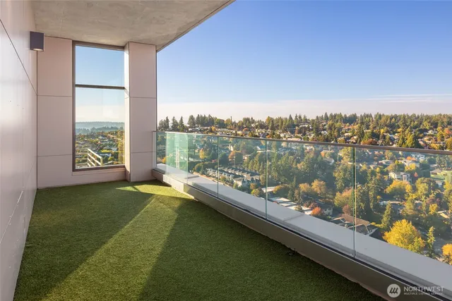 a view of a lake from a balcony with outdoor space