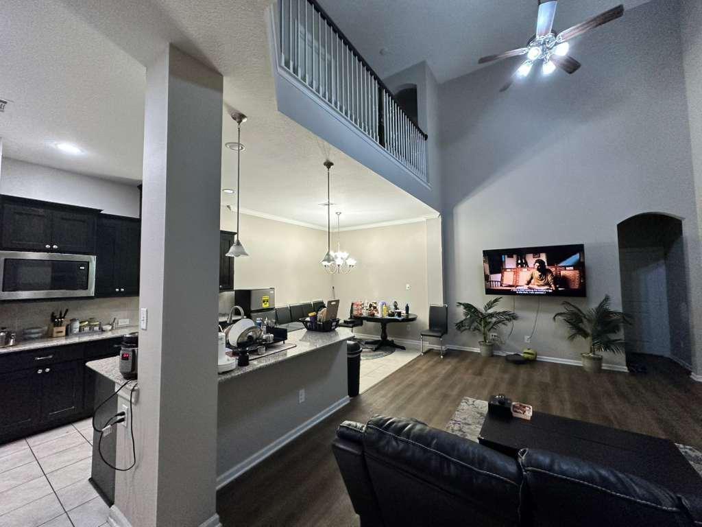 6655 DeLeon Street Irving, TX 75039 - Photo 5 of 10 a living room with furniture and a flat screen tv