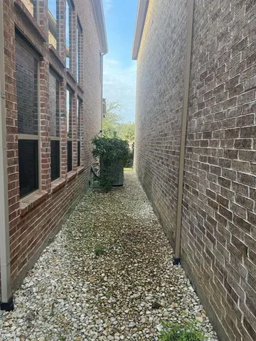 a view of a pathway both side of house