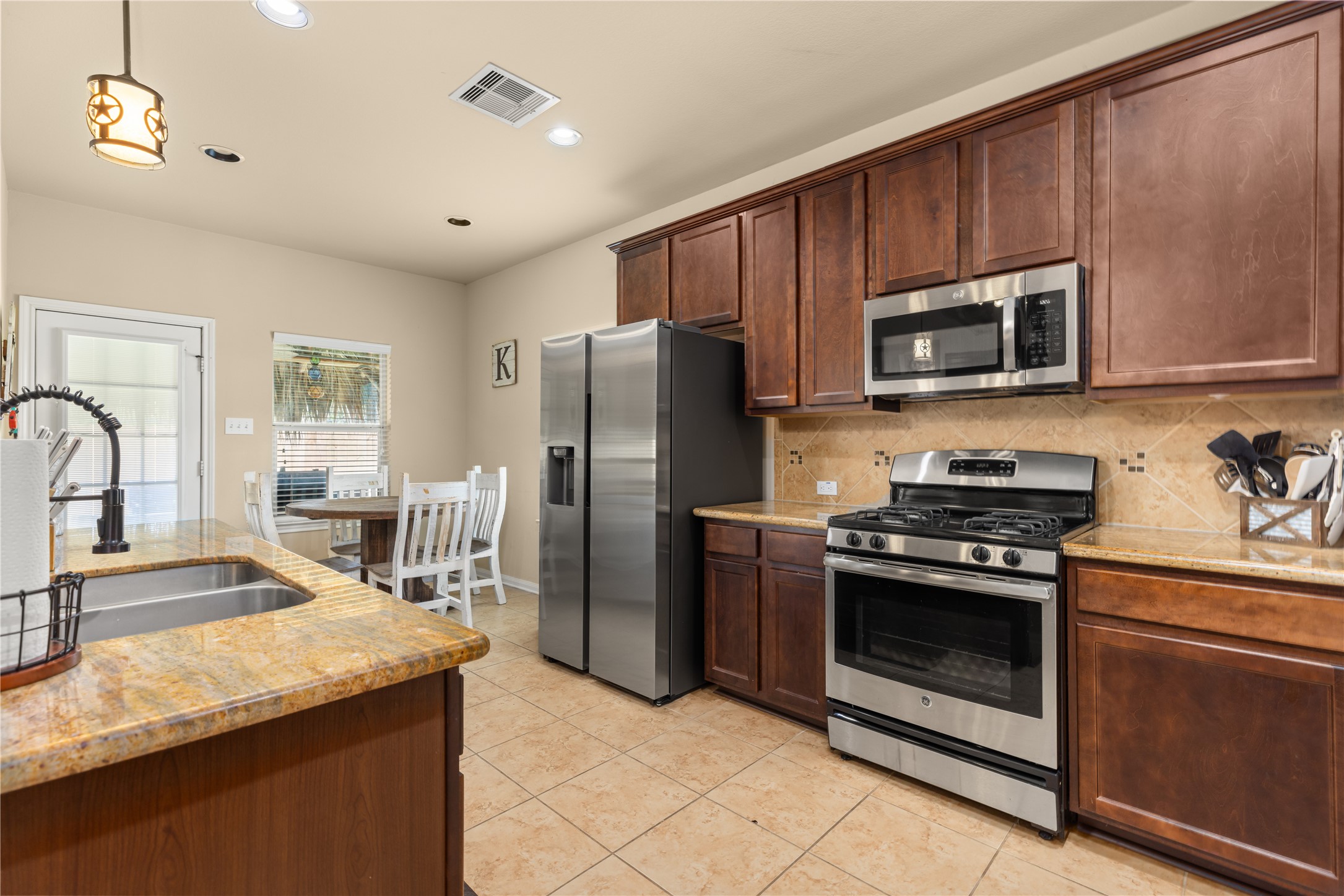 1010 Nantucket Street Pasadena, TX 77503 - Photo 15 of 46 Kitchen with granite countertops and stainless steel appliances