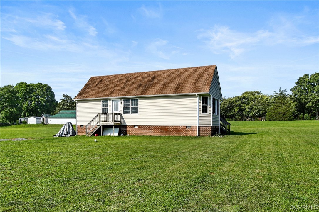 8376 Pine Acres Lane Carson, VA 23830 - Photo 20 of 21 a view of a house with a yard
