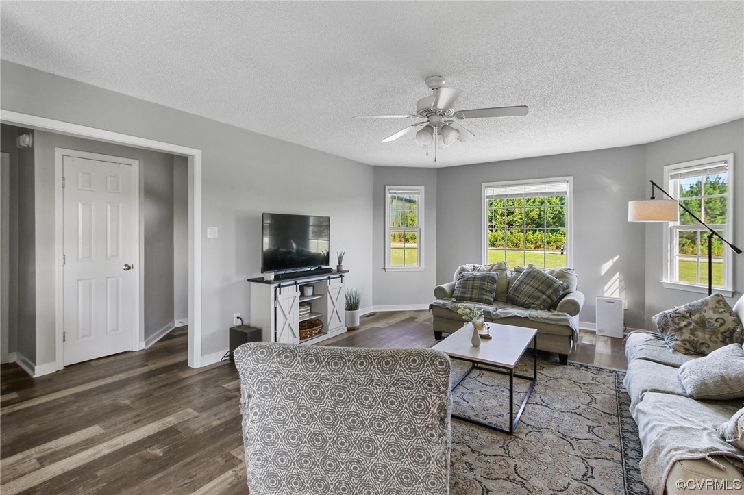 8376 Pine Acres Lane Carson, VA 23830 - Photo 6 of 21 a living room with furniture and a flat screen tv