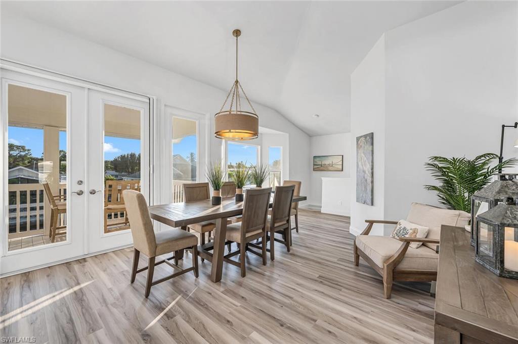 2736 Gulfview Drive Naples, FL 34112 - Photo 12 of 29 a view of a dining room with furniture window and wooden floor