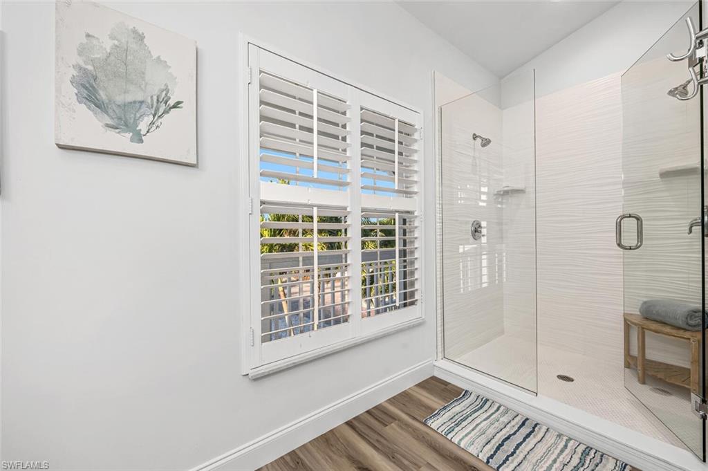 2736 Gulfview Drive Naples, FL 34112 - Photo 15 of 29 a view of wooden floor and bathroom in a room
