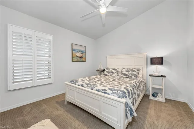 a bedroom with a bed and a table