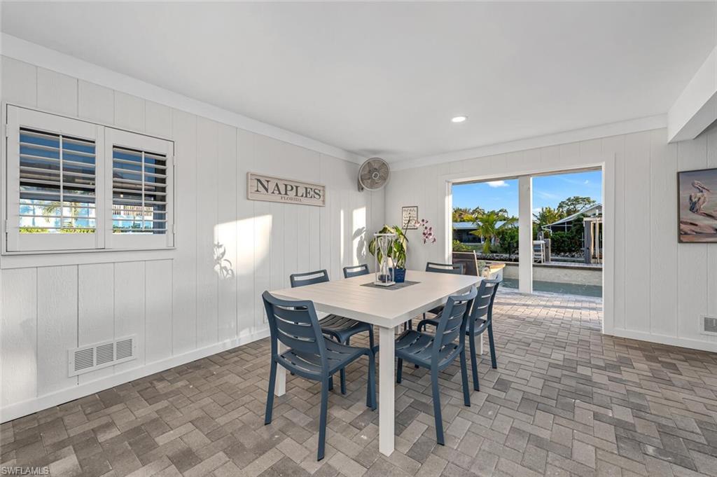 2736 Gulfview Drive Naples, FL 34112 - Photo 22 of 29 a view of a dining room with furniture and window