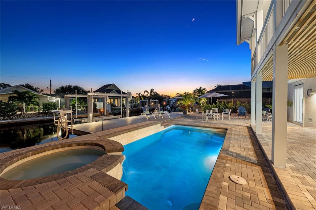 2736 Gulfview Drive Naples, FL 34112 - Photo 25 of 29 a view of a swimming pool and lounge chairs