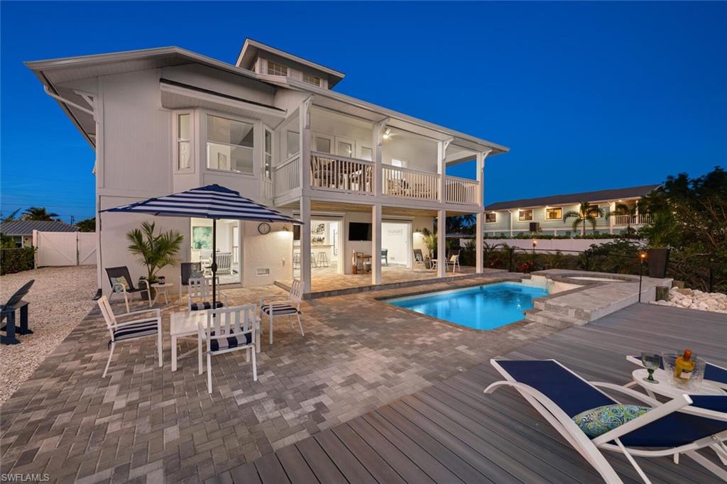 2736 Gulfview Drive Naples, FL 34112 - Photo 27 of 29 a view of a chairs and table in the patio