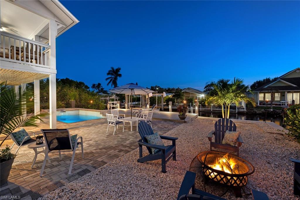 2736 Gulfview Drive Naples, FL 34112 - Photo 6 of 29 a swimming pool with outdoor seating and yard