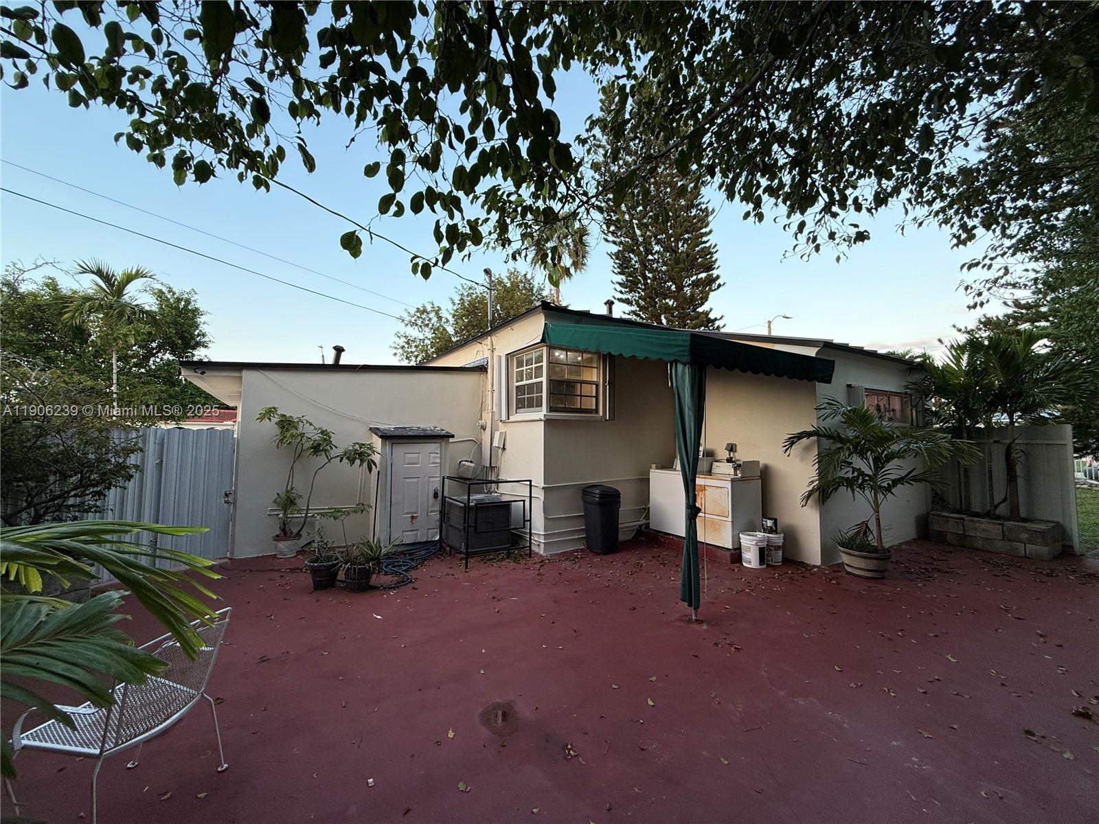 6300 Northwest 2nd Street Miami, FL 33126 - Photo 13 of 26 a view of a house with backyard and sitting area