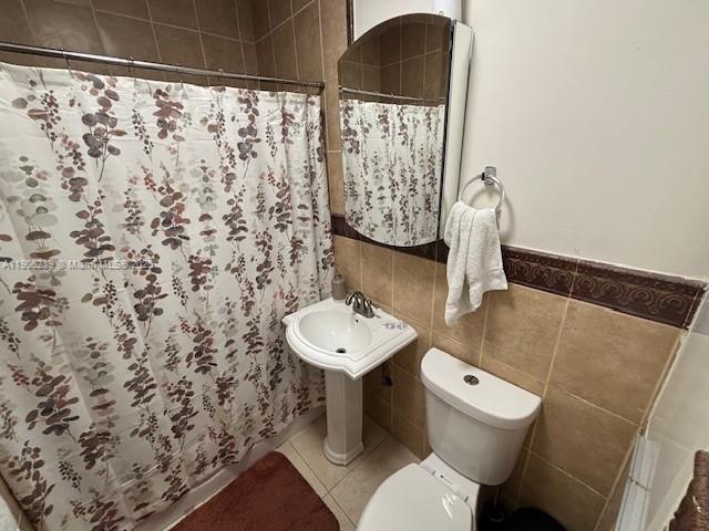 6300 Northwest 2nd Street Miami, FL 33126 - Photo 10 of 26 a bathroom with a sink toilet and a mirror