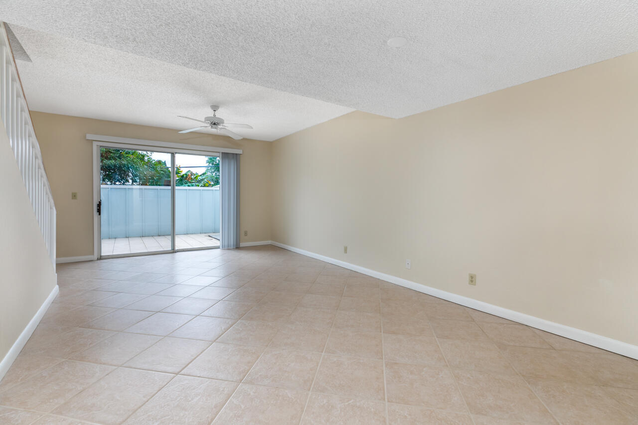 6262 Riverwalk Lane, Unit 5 Jupiter, FL 33458 - Photo 17 of 42 an empty room with windows and outdoor view