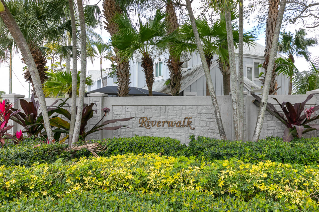 6262 Riverwalk Lane, Unit 5 Jupiter, FL 33458 - Photo 28 of 42 a view of a pathway with a flower garden