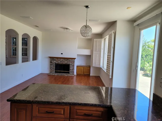 a view of livingroom and kitchen with wooden floor