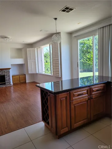 a kitchen with stainless steel appliances granite countertop a sink and a stove