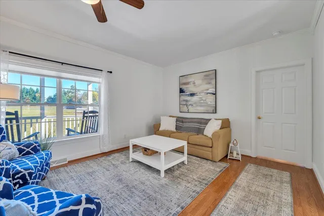a bedroom with bed and a chandelier
