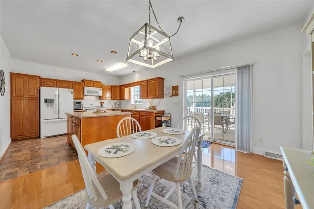 a bedroom with bed and a chandelier