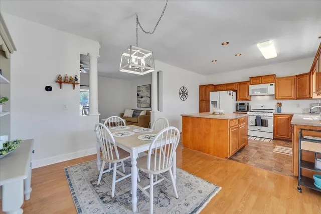 a view of a patio with a table and chairs