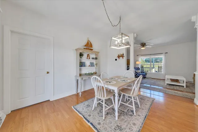 a view of a chairs and table in the balcony
