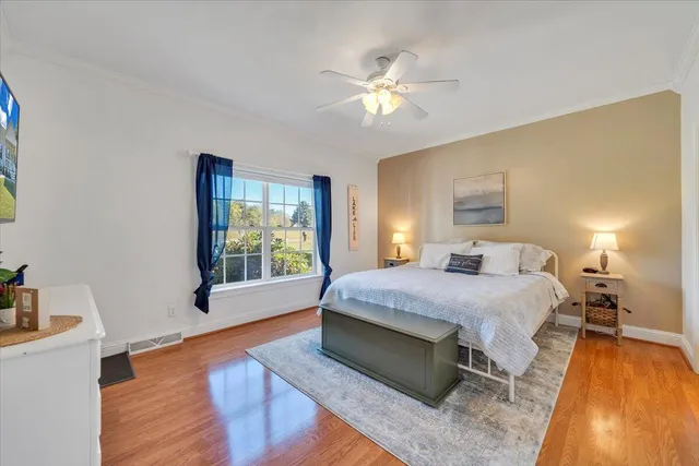 a bedroom with bed and a window