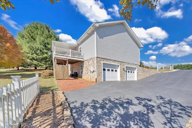 a room with pool table and glass door