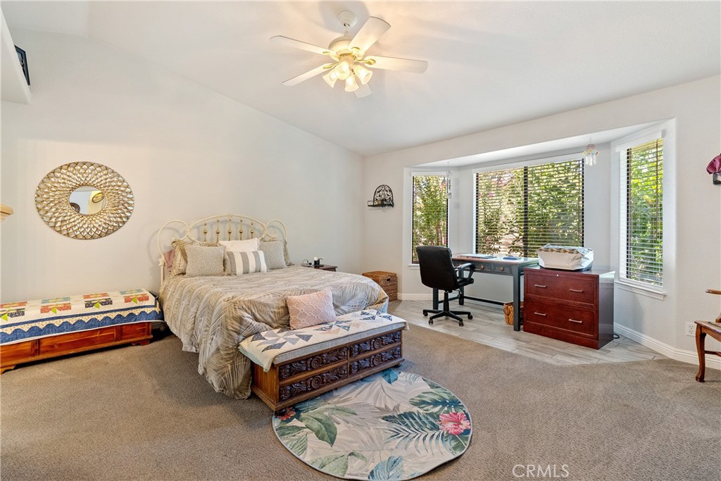 11625 Cenegal Road Atascadero, CA 93422 - Photo 18 of 65 The primary suite boasts vaulted ceilings and a large bay window which gives lovely views out the front of the home.