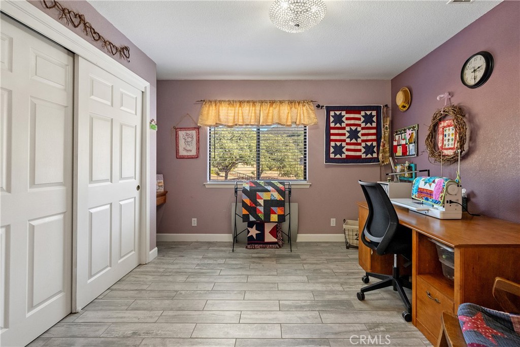 11625 Cenegal Road Atascadero, CA 93422 - Photo 23 of 65 Bedroom 2 has tile floors, alluring view out the front and a built-in desk.