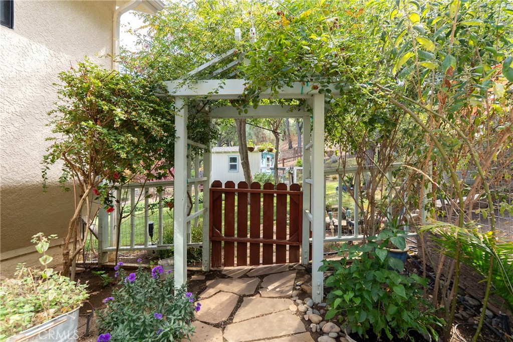 11625 Cenegal Road Atascadero, CA 93422 - Photo 41 of 65 Charming archway gives access between the side yard and the back of the home.