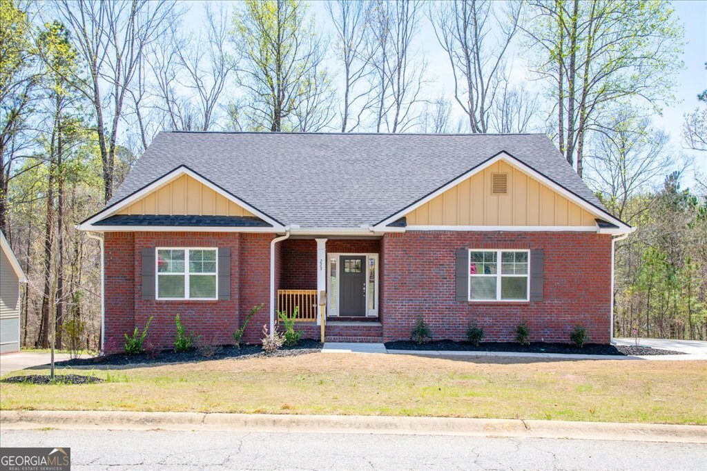 361 Eagle Ridge Road Macon, GA 31216 - Photo 2 of 50 a front view of house with yard and trees in the background