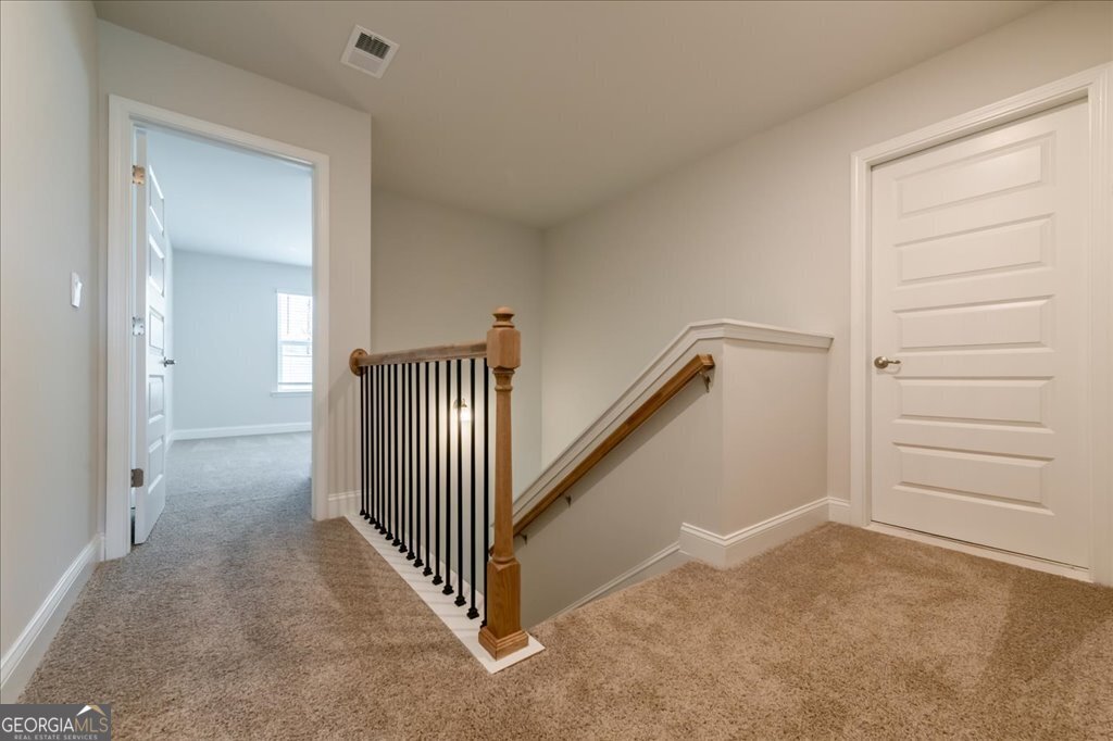 361 Eagle Ridge Road Macon, GA 31216 - Photo 21 of 50 wooden floor in a hall with a cabinet