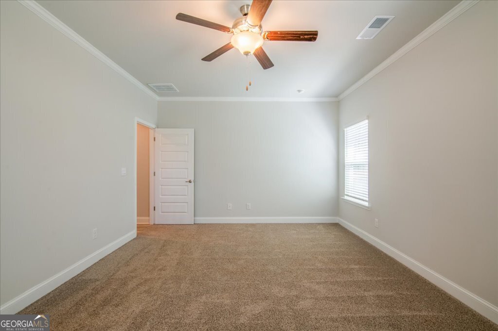 361 Eagle Ridge Road Macon, GA 31216 - Photo 26 of 50 an empty room with fan and windows