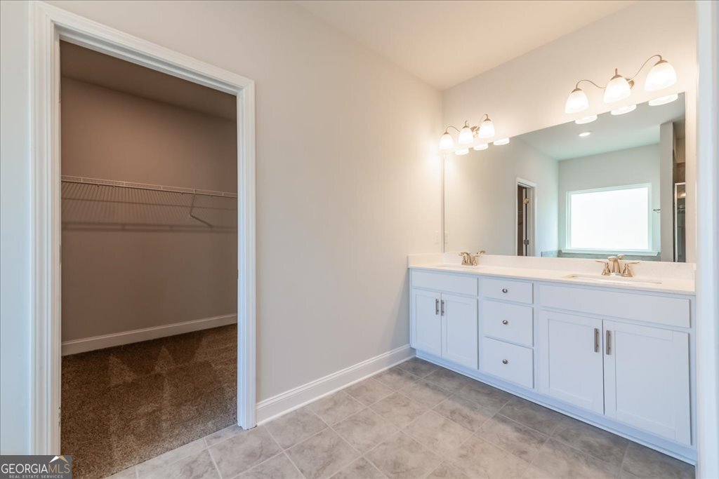 361 Eagle Ridge Road Macon, GA 31216 - Photo 28 of 50 a spacious bathroom with a double vanity sink and a mirror