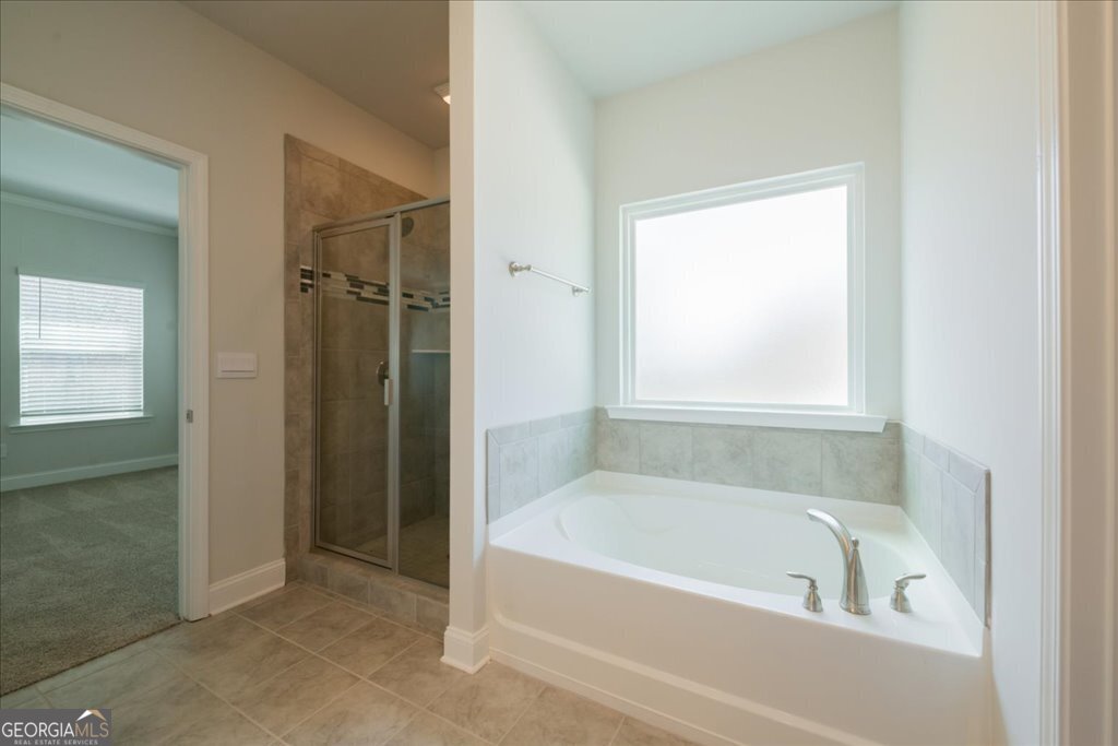 361 Eagle Ridge Road Macon, GA 31216 - Photo 31 of 50 a bathroom with a bathtub and a shower