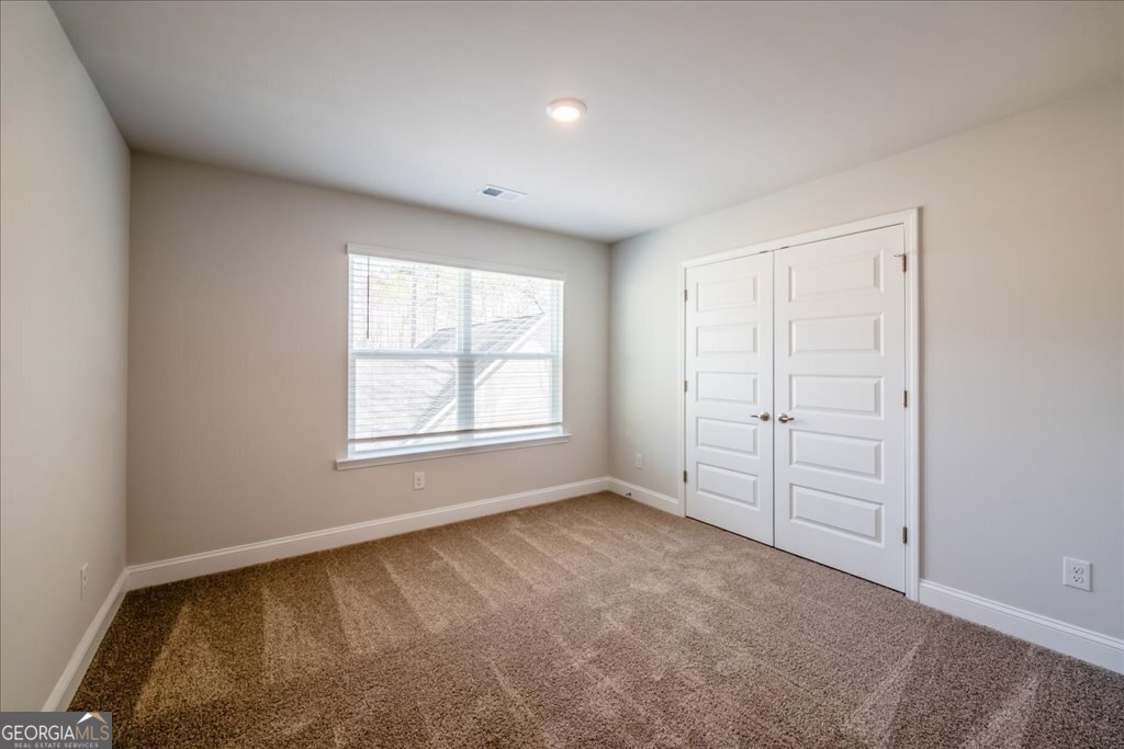 361 Eagle Ridge Road Macon, GA 31216 - Photo 33 of 50 an empty room with windows