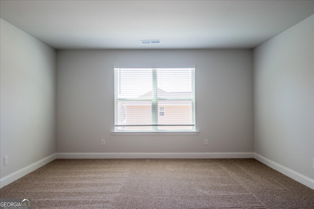 361 Eagle Ridge Road Macon, GA 31216 - Photo 35 of 50 an empty room with a window